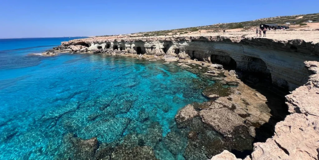 Limestone sea caves and clear turquoise water along the Cape Greco coast near Ayia Napa, Cyprus